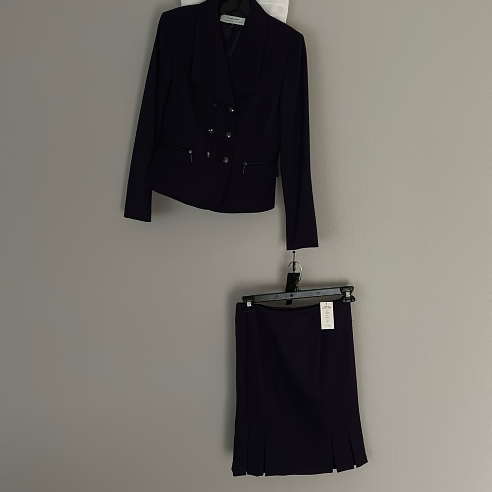 Tahari suit jacket & skirt plum color 
Size 4 
Smoke free & pet free house